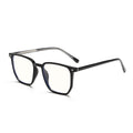 45-degree perspective of the over-sized black TR90 frame showing the sleek temple design.