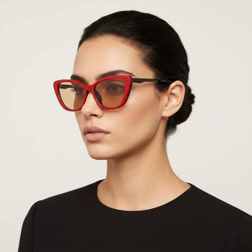 Red cat-eye sunglasses with black frames on a white background
